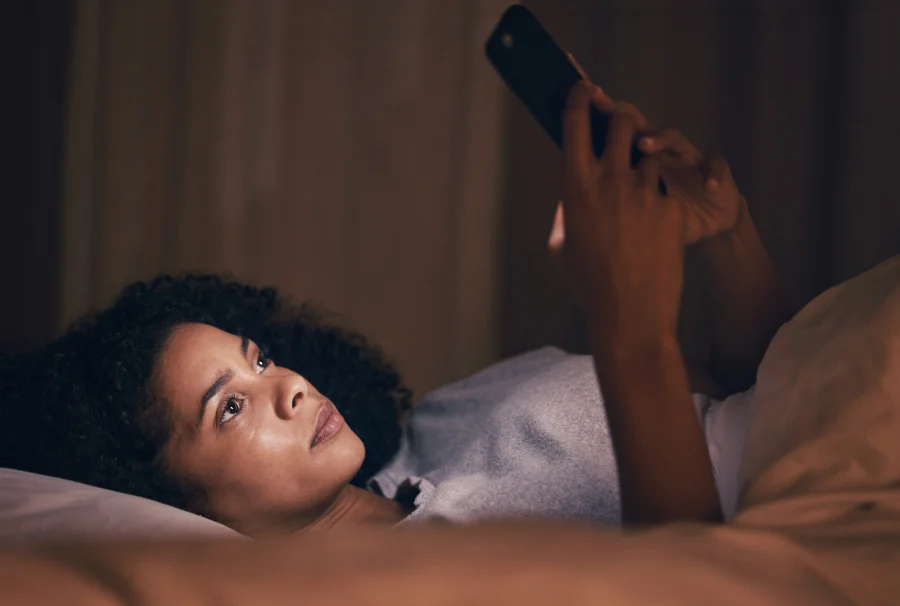 Envato - Search, night and phone with woman in bedroom for social media app, insomnia and networking. Commun.