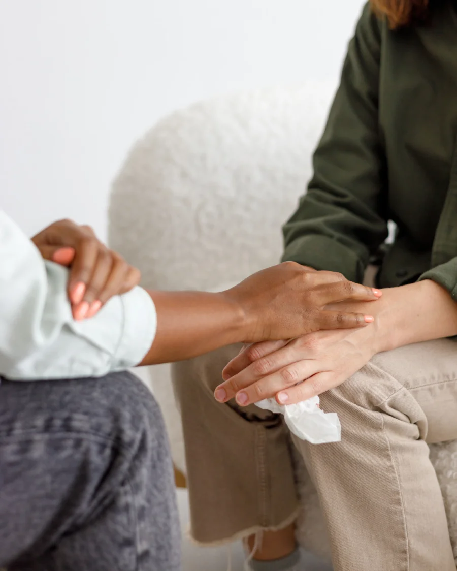 mental support to hold hands, handshake. An African-American female psychologist holds an appointment with a patient in the office - mental support to hold hands, handshake. An African-American female psychologist holds an appointment with a patient in the office. mental health and